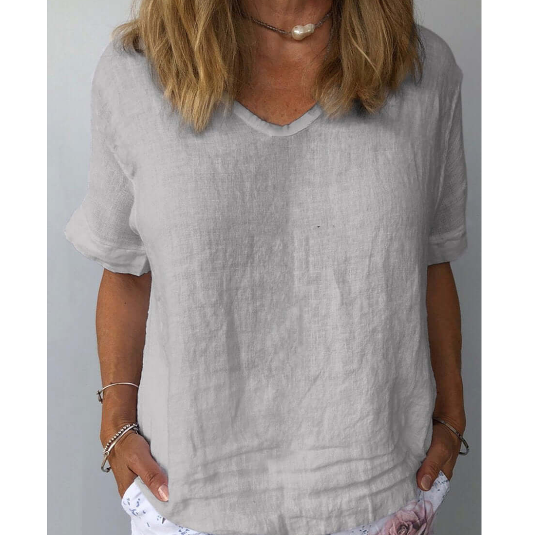 Versatile women's summer blouse: a comfortable relaxed fit short sleeve V-neck shirt.