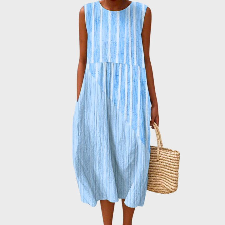 Women's knee-length sleeveless casual dress with pockets, designed for relaxed everyday comfort.
