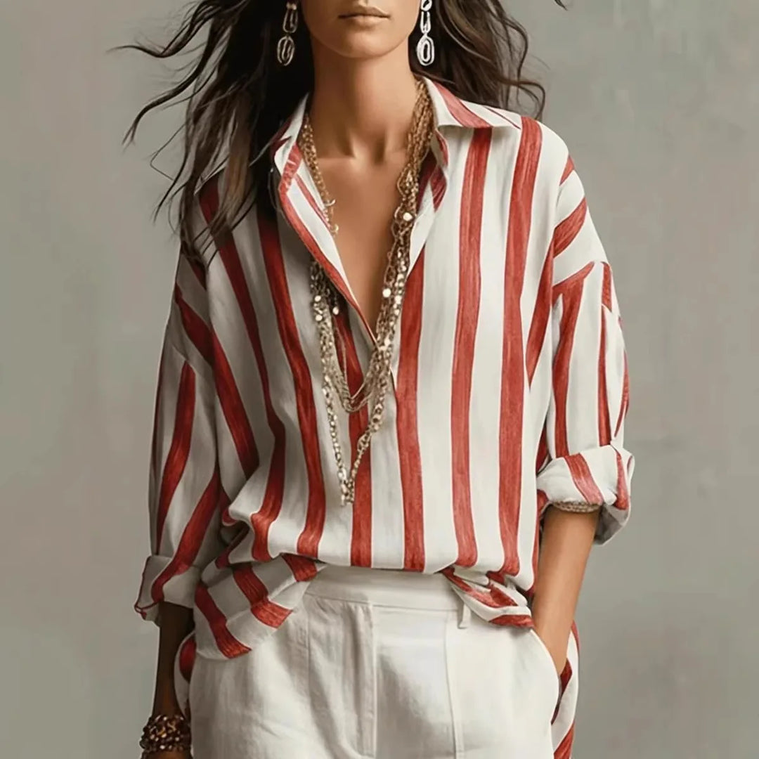 Casual women's striped button-down shirt with a relaxed fit. Long-sleeve collared top for comfortable everyday fashion.