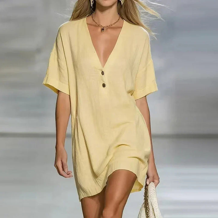 Women's relaxed fit V-neck button-front shirt dress, perfect for comfortable everyday wear.