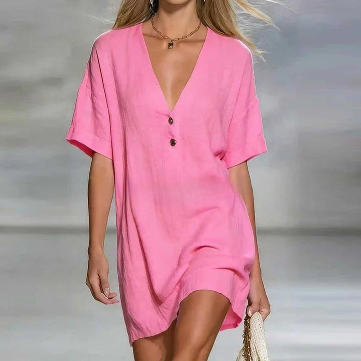 Casual women's summer shirt dress with a stylish V-neck and functional button front. Lightweight and versatile.