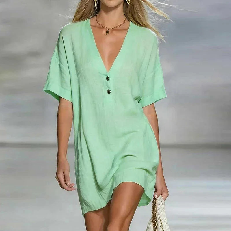 Comfortable women's V-neck shirt dress. Relaxed fit button-front style, ideal for warm weather fashion.