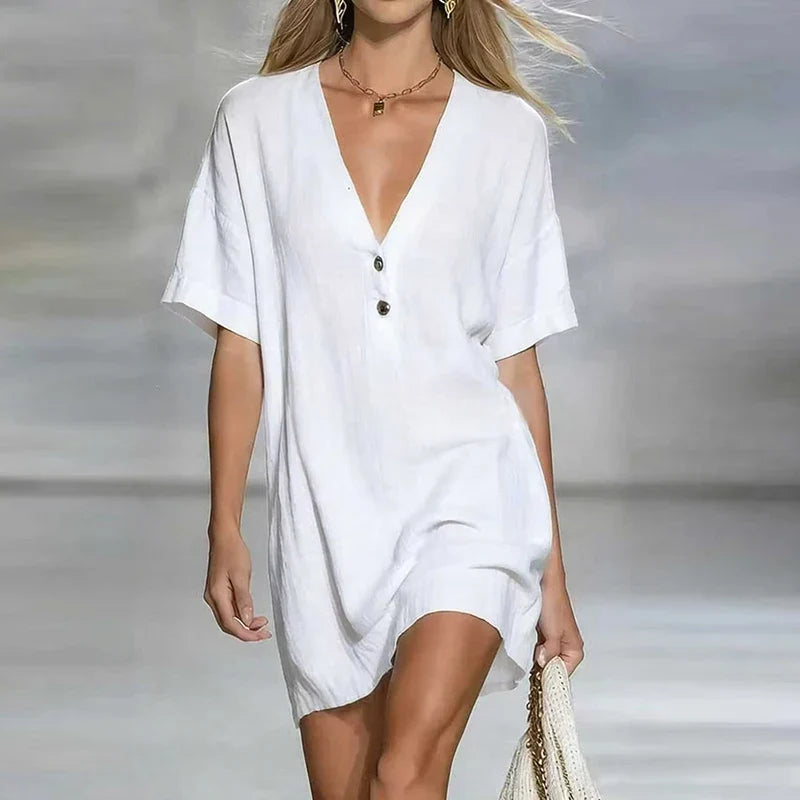 Lightweight women's button-front shirt dress with a flattering V-neck, designed for summer comfort.