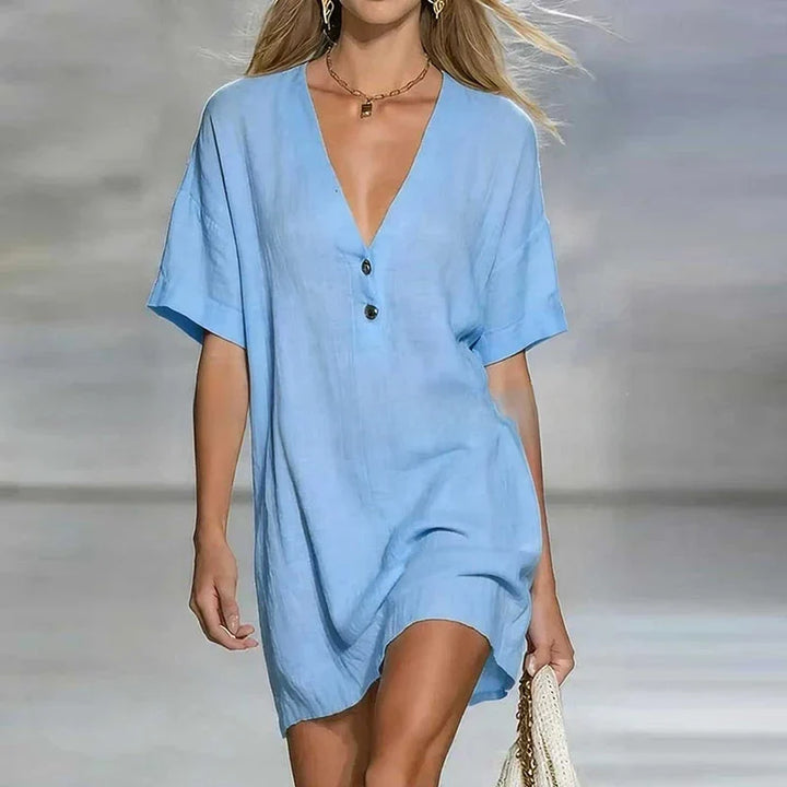Versatile women's relaxed fit shirt dress, featuring a chic V-neck and full button-front closure.