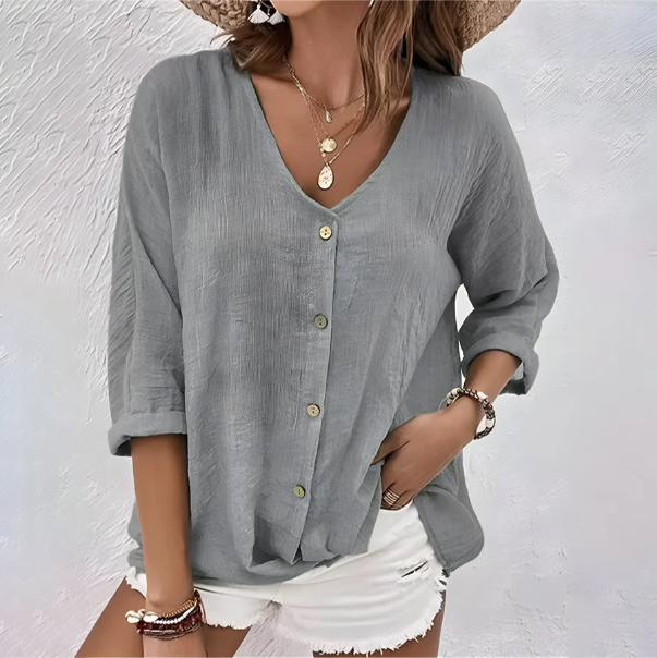 Chic women's V-neck button-up summer blouse with relaxed fit, long sleeves. Ideal for casual versatile fashion.