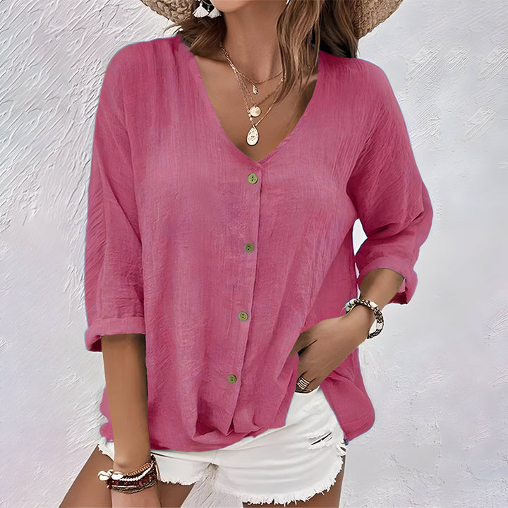 Stylish women's long sleeve V-neck blouse, button-up design. Relaxed fit for comfortable chic casual wear.