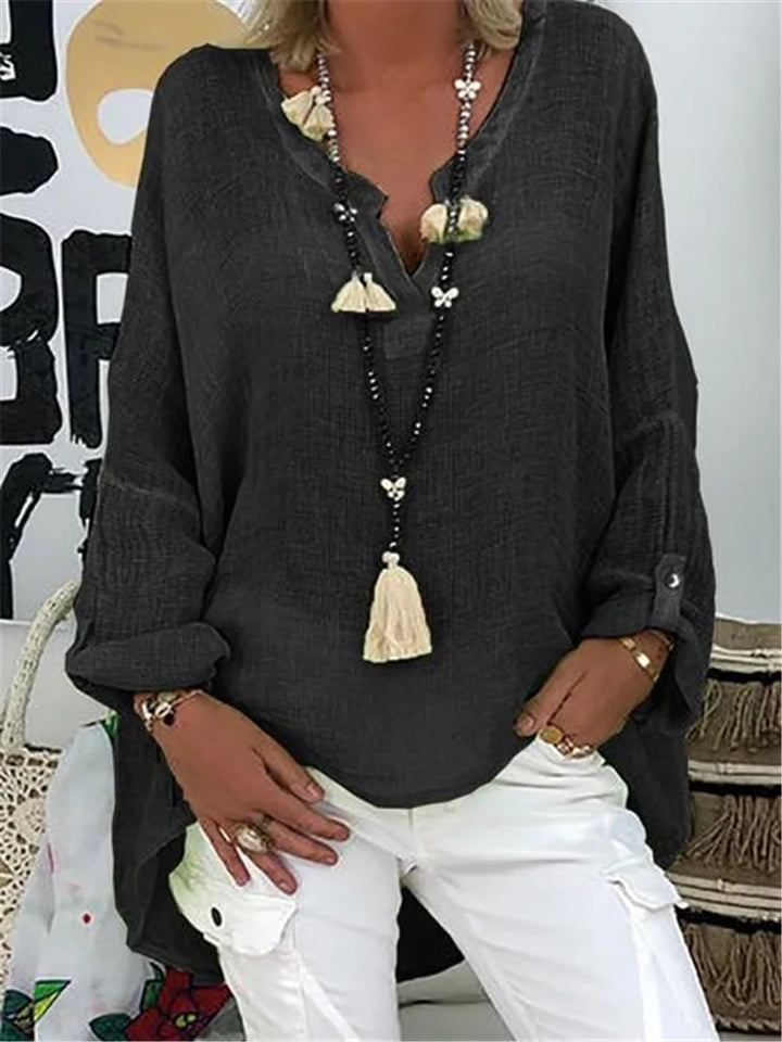 Plus size women's V-neck long sleeve blouse, relaxed fit, ideal casual or workwear top.