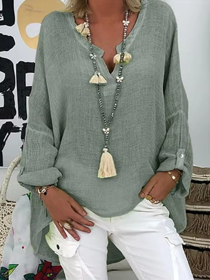 Casual women's relaxed fit V-neck long sleeve top, a versatile and comfortable blouse option.