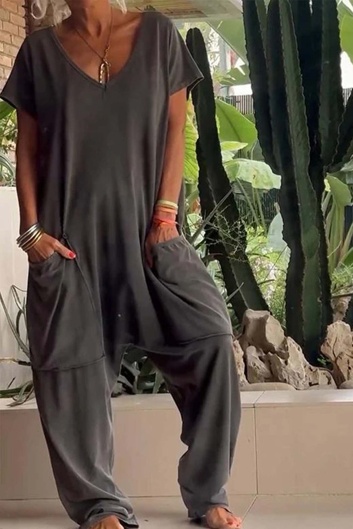 Stylish women's relaxed V-neck short sleeve jumpsuit with dropped crotch, ideal casual, summer or travel wear.