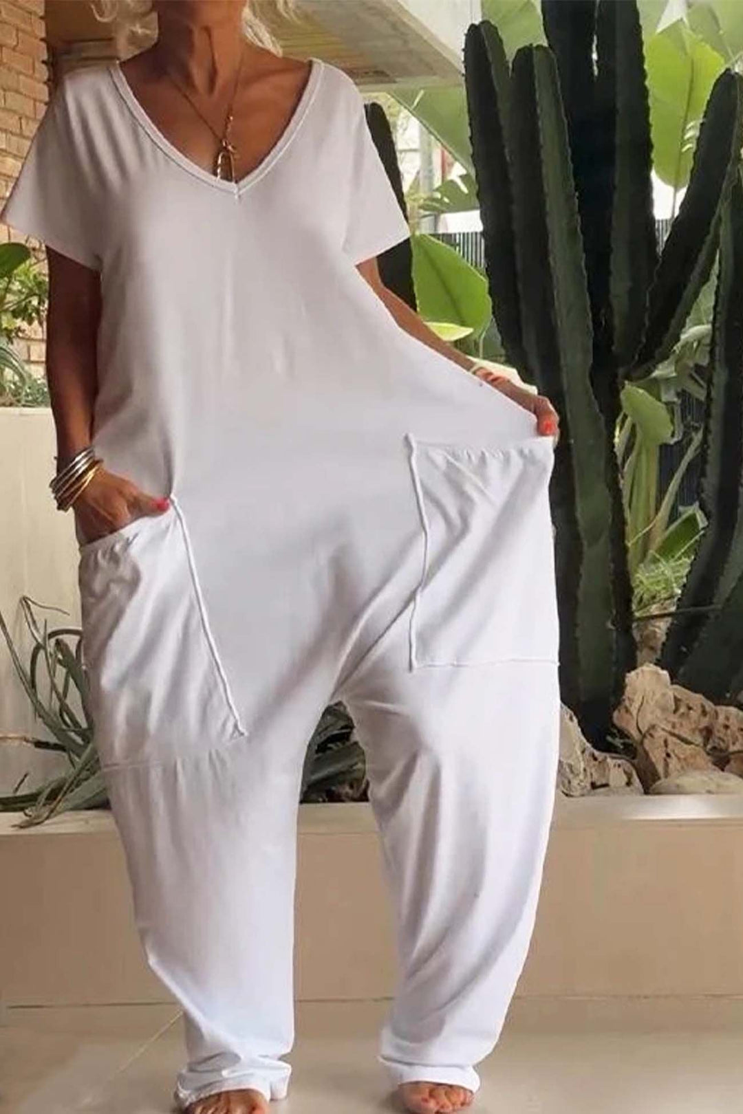 Women's casual short sleeve V-neck jumpsuit, featuring a comfortable relaxed fit and trendy dropped crotch.