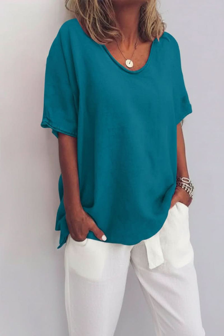 Breathable women's V-neck top, relaxed fit for ultimate summer comfort and versatile everyday styling.