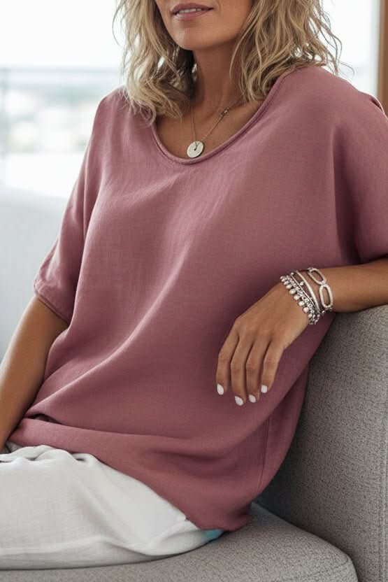 Comfortable women's relaxed fit V-neck top, perfect for summer, casual outings, and everyday style.
