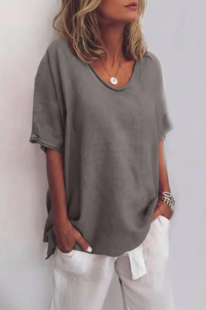 Versatile women's V-neck summer top, relaxed fit, great for comfortable and casual everyday fashion.