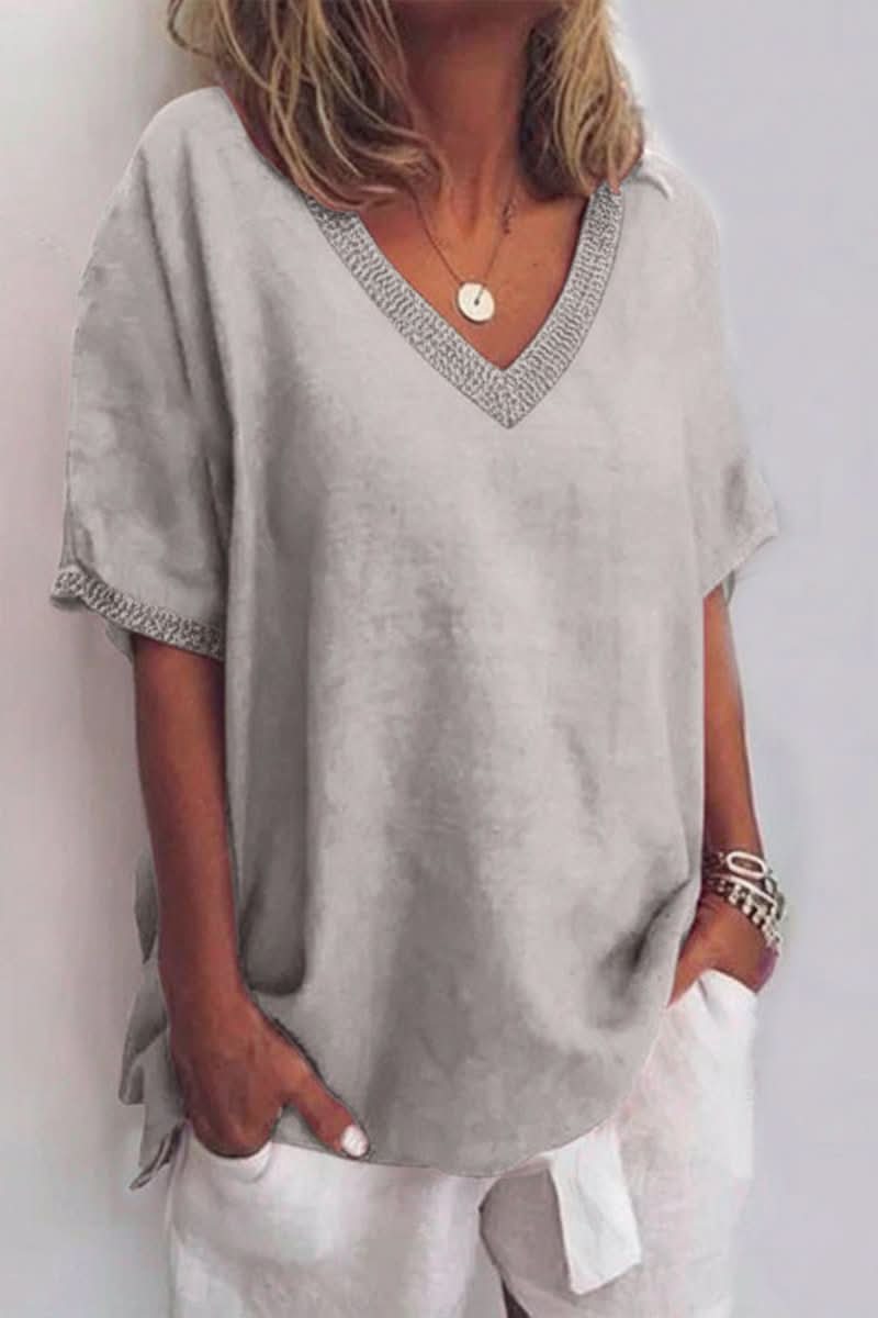 Relaxed fit women's V-neck summer blouse, a comfortable and stylish essential for warm weather fashion.