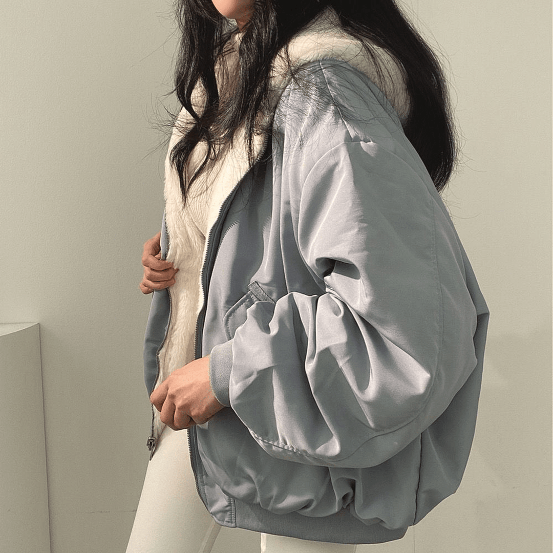 Women's relaxed fit winter jacket, forest green, back view, highlighting the spacious and cozy design.