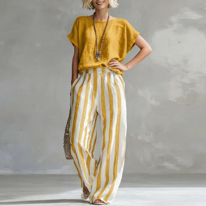 Women's relaxed linen blend two-piece summer set with wide-leg pants & short-sleeve top. Perfect for resort wear.