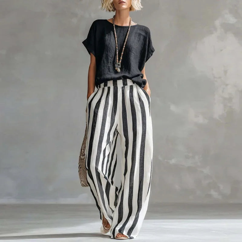 Casual women's linen blend summer set featuring a relaxed fit, wide-leg pants, & short-sleeve top for comfort.