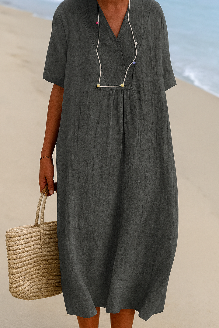 Women's relaxed V-neck beach dress with short sleeves, perfect for summer vacations & resort wear.