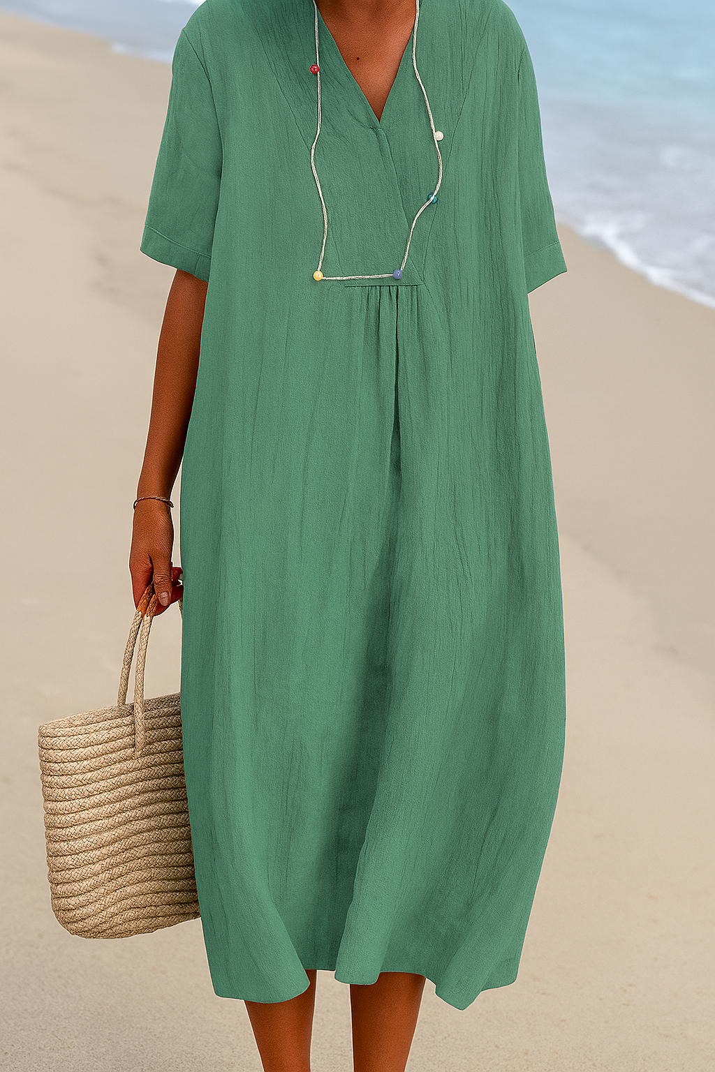 Flowy women's relaxed fit summer dress with V-neck & short sleeves for casual beach days.