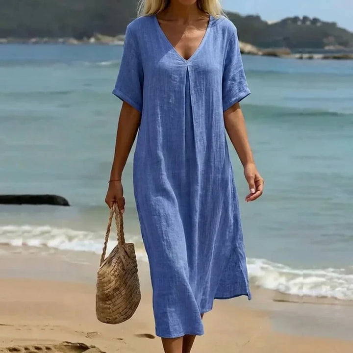 Women's relaxed V-neck midi dress with short sleeves, perfect for casual summer wear.