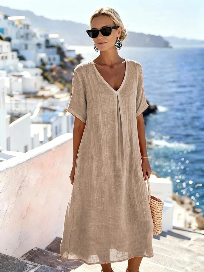 Versatile women's relaxed midi dress, V-neck, short sleeves, suitable for casual or vacation.