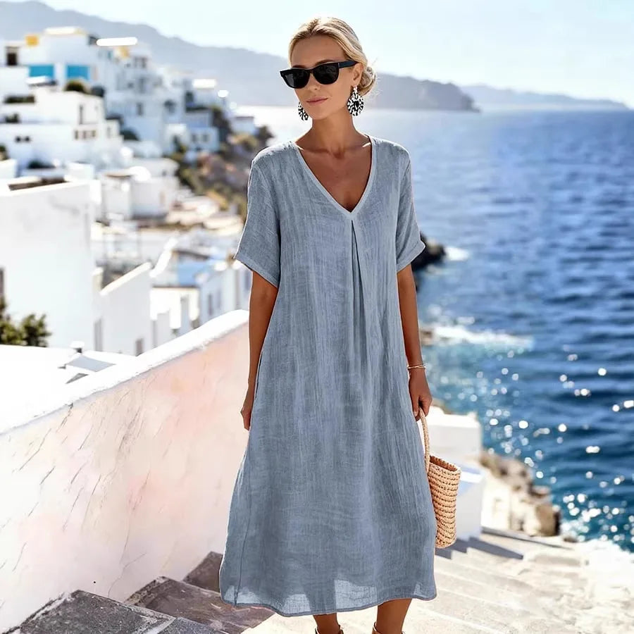 Stylish women's short-sleeve midi dress, V-neck, relaxed fit for everyday comfort.