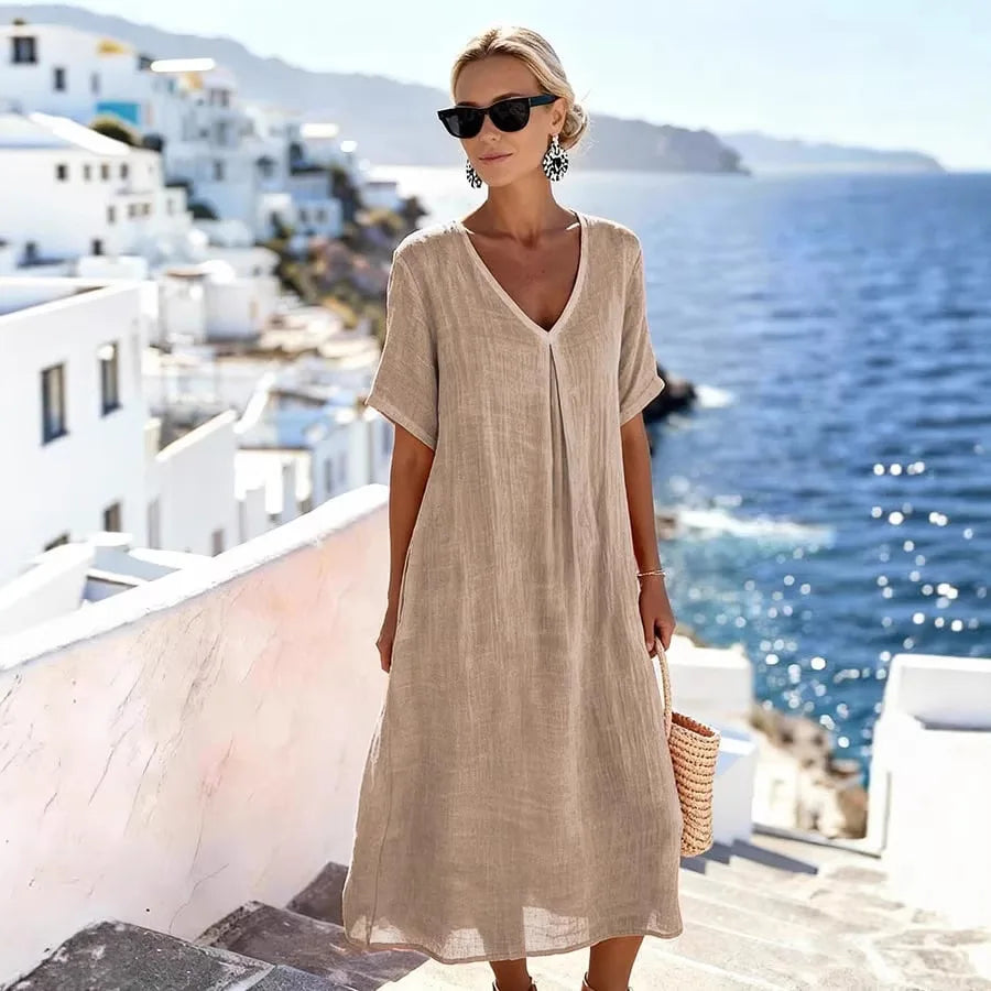 Comfortable women's midi dress, relaxed fit, V-neck, short sleeve, perfect for everyday wear.