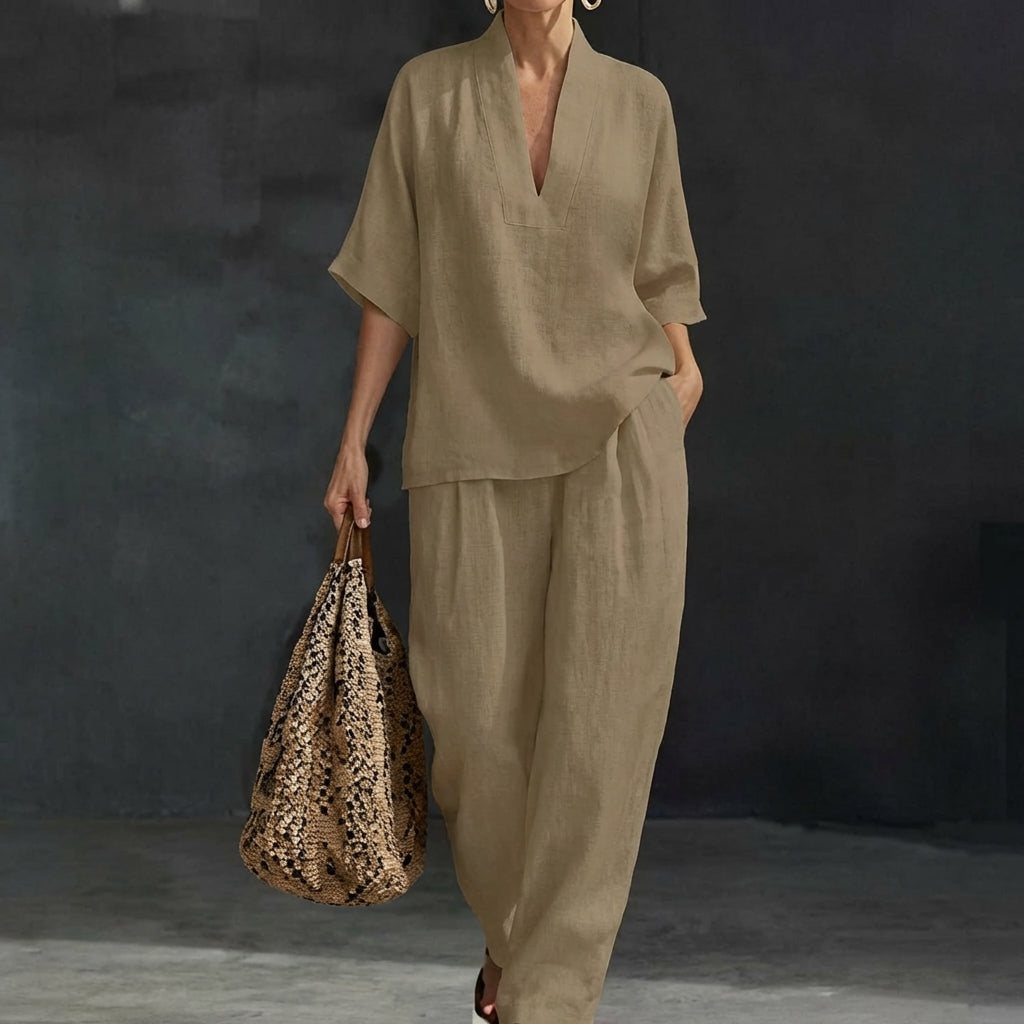 Women's relaxed two-piece set. V-neck top and wide-leg pants, offering comfort and style for versatile wear.