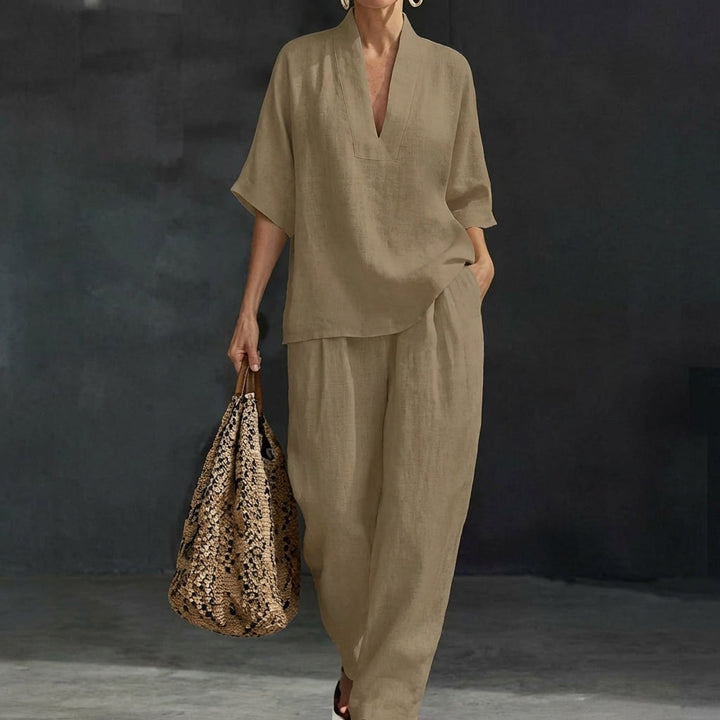 Women's relaxed two-piece set. V-neck top and wide-leg pants, offering comfort and style for versatile wear.