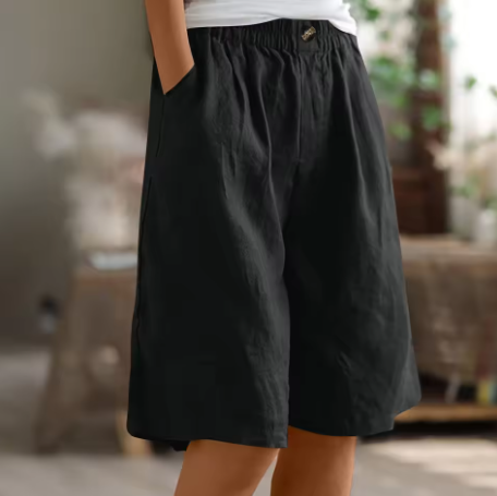 Flowy wide leg Bermuda shorts for women, relaxed fit, elastic waist for comfortable summer movement.