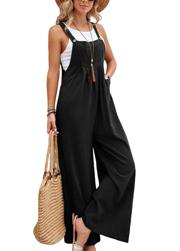 Casual women's wide leg jumpsuit with adjustable spaghetti straps & convenient side pockets. Relaxed summer style.