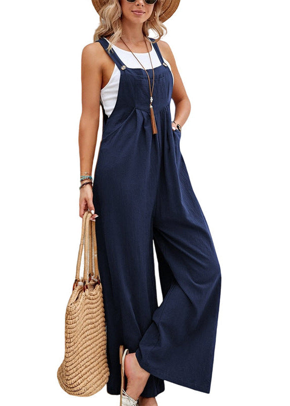 Bohemian-inspired women's relaxed fit wide leg jumpsuit. Comfortable one-piece with adjustable straps & pockets.