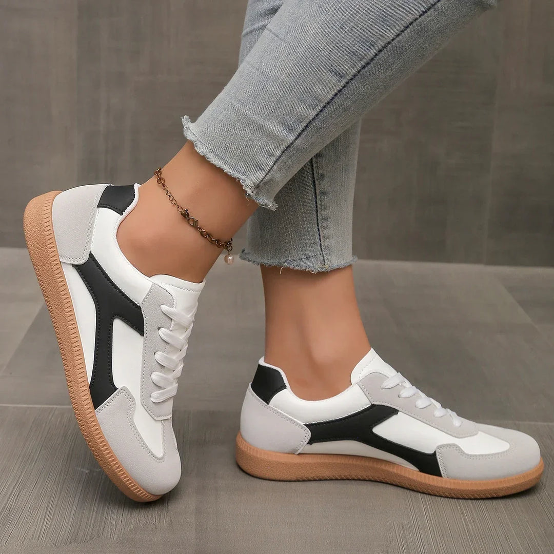 Women's footwear: retro low profile sneakers with a comfortable cushioned footbed & classic gum sole.