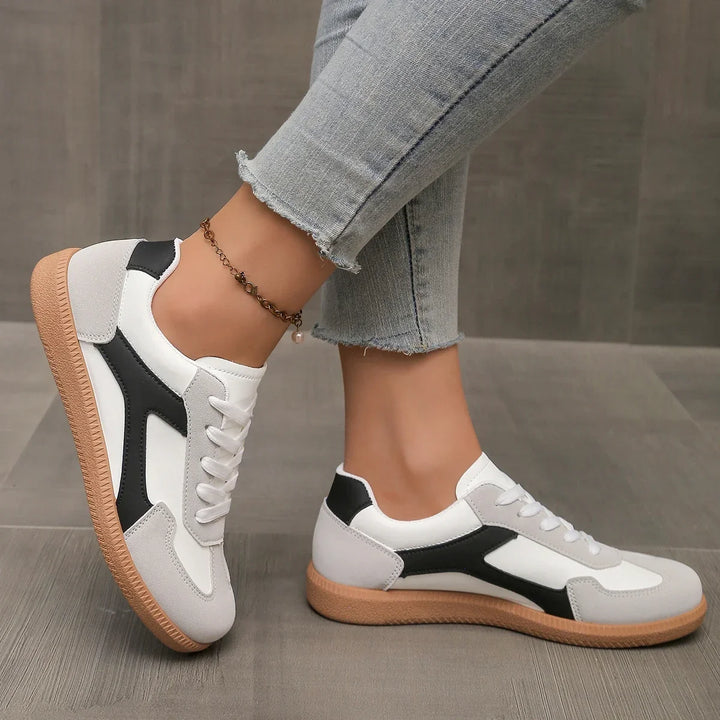 Women's footwear: retro low profile sneakers with a comfortable cushioned footbed & classic gum sole.