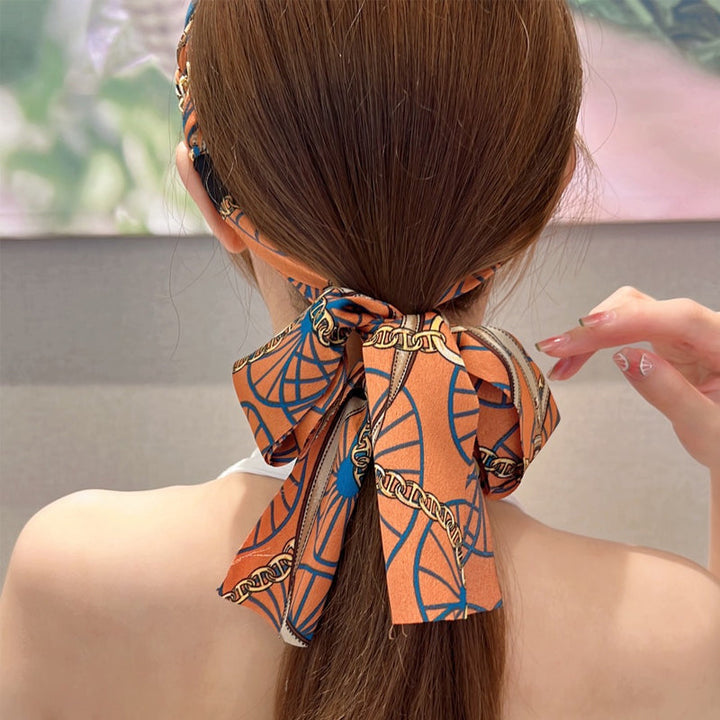 Close-up of a women's retro ribbon hairband, showcasing its elegant pattern for braiding.