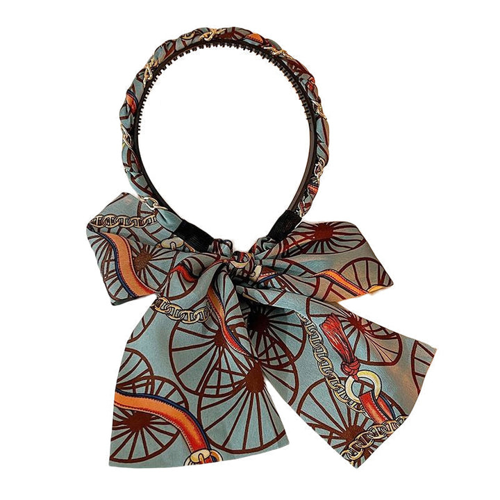 Detail shot of a women's retro ribbon hairband, highlighting its quality and braiding utility.
