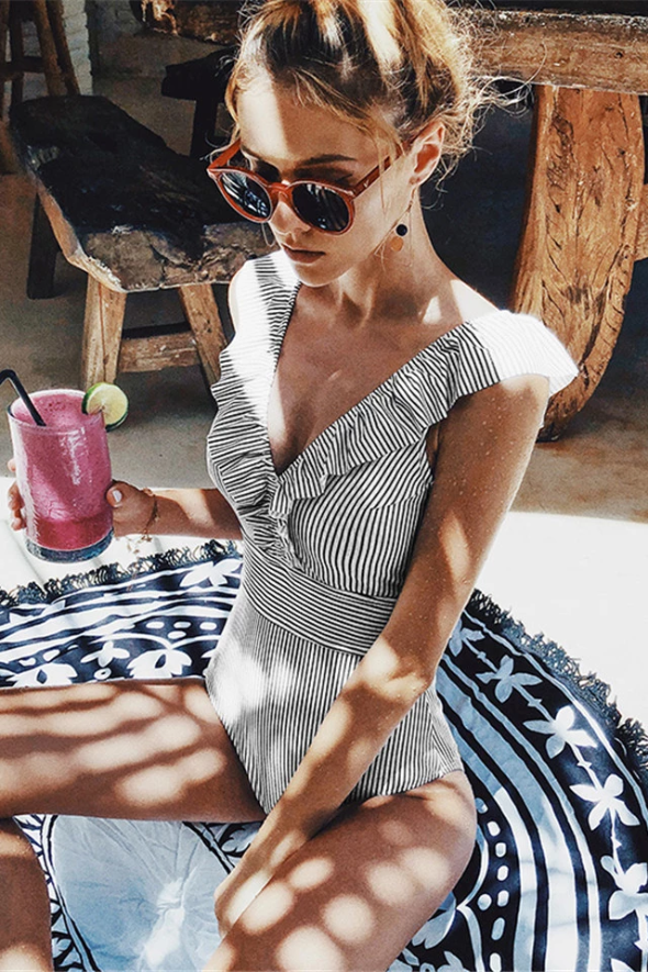 Women's retro striped one-piece swimsuit, vintage style for beach & pool. Flattering & comfortable summer fashion.