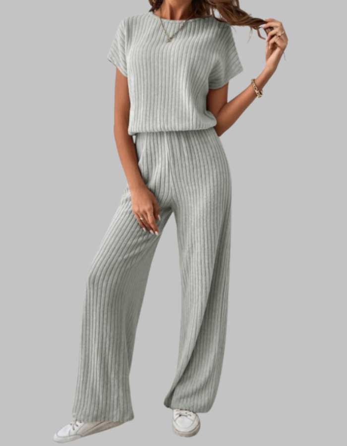Soft ribbed women's two-piece set, featuring a short sleeve top & flowing wide leg pants for a chic look.
