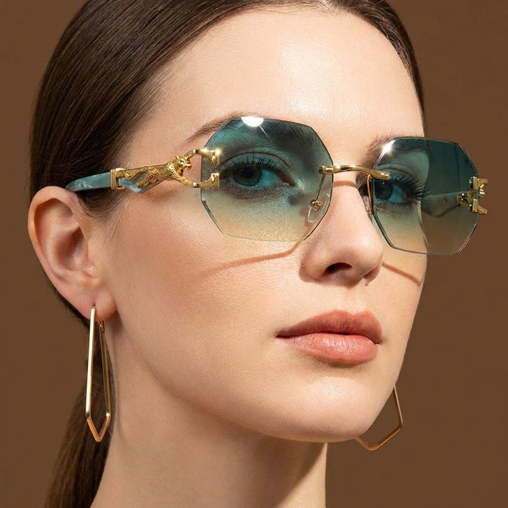 Women's rimless geometric sunglasses with gold panther detail. Luxury fashion eyewear, UV protection.
