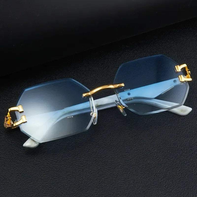 Women's rimless geometric sunglasses, gradient lenses, and iconic gold panther hardware. Chic & UV protective.
