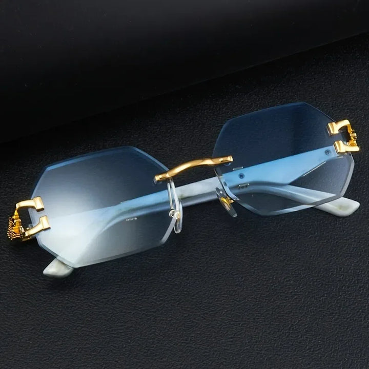 Women's rimless geometric sunglasses, gradient lenses, and iconic gold panther hardware. Chic & UV protective.