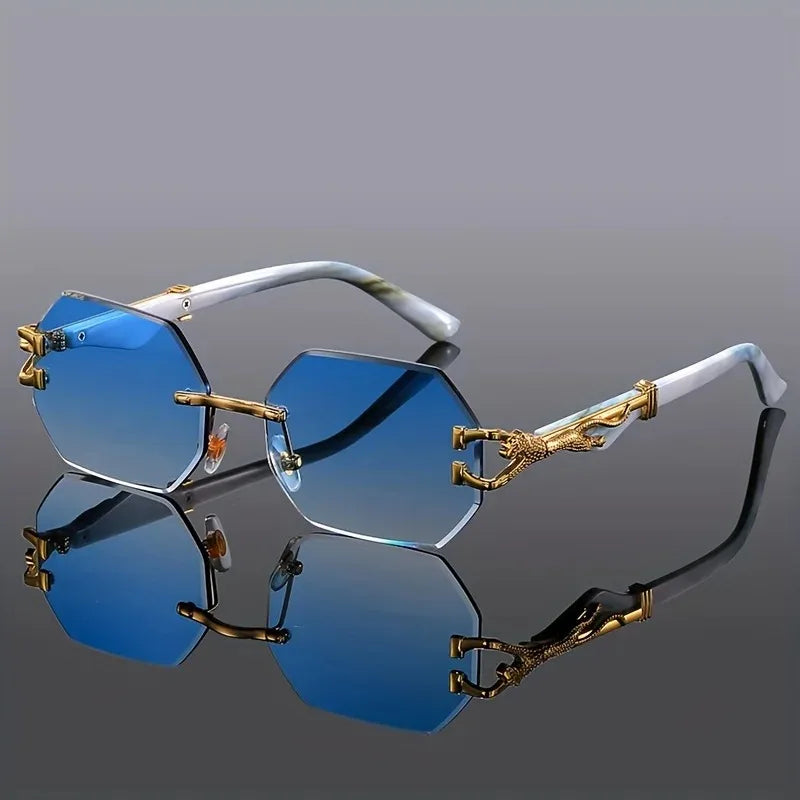 Fashionable women's geometric sunglasses, rimless design with gold panther hardware & gradient lenses. UV protection.