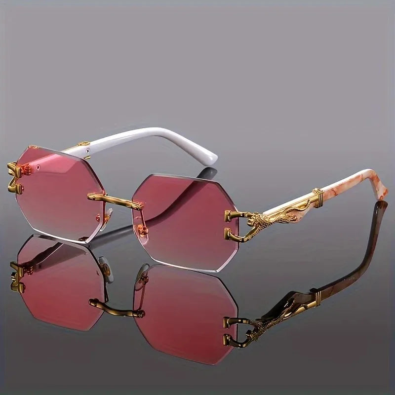 Statement luxury women's rimless geometric sunglasses. Gold panther detail & gradient lenses for a chic style.