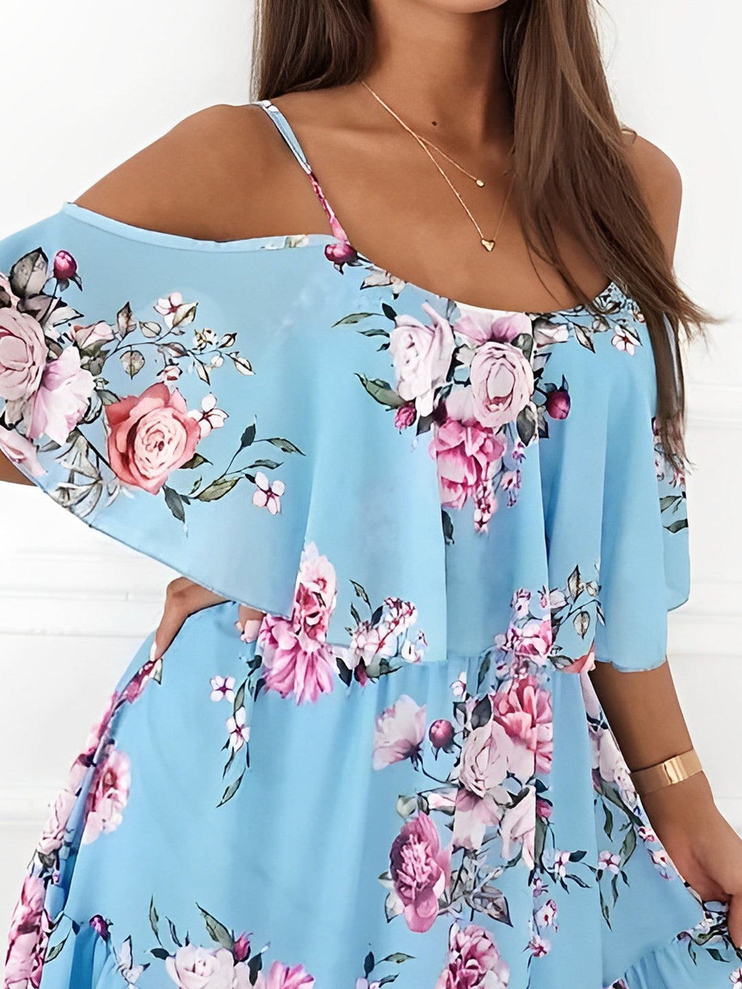 Lightweight flowy women's mini dress, romantic floral print with cold shoulders, great for warm weather.
