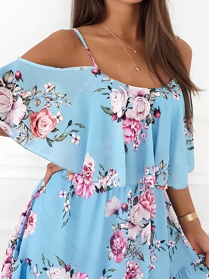 Lightweight flowy women's mini dress, romantic floral print with cold shoulders, great for warm weather.