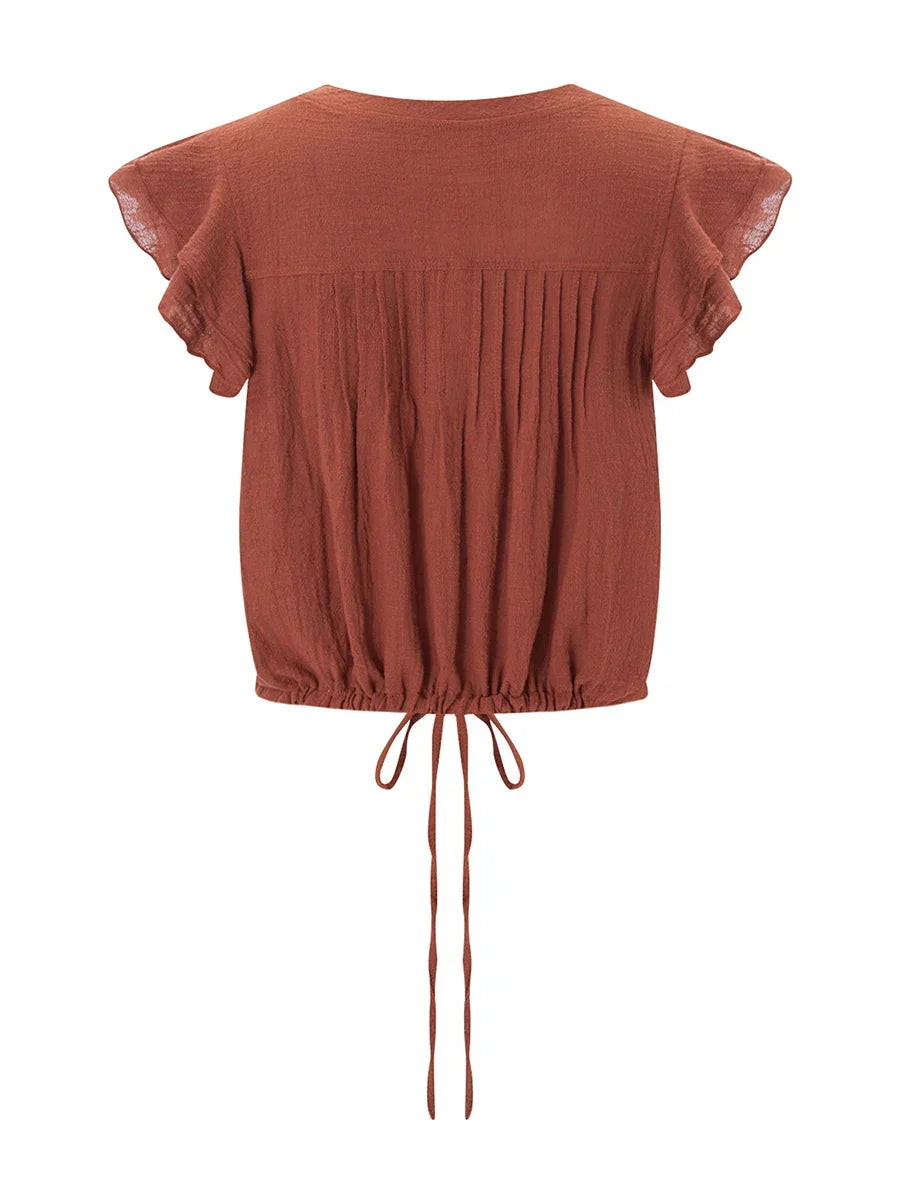 Summer fashion women's ruffle crop top, featuring a flattering cropped fit and flutter sleeves.