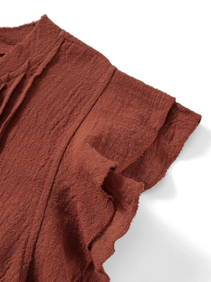 Feminine women's ruffle crop top, stylish for summer outings and comfortable resort wear.