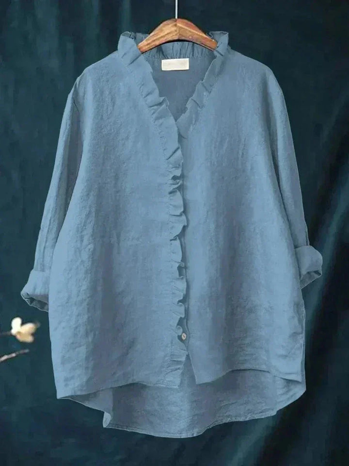 Stylish women's summer top featuring a ruffle neck and relaxed fit for chic, comfortable fashion.