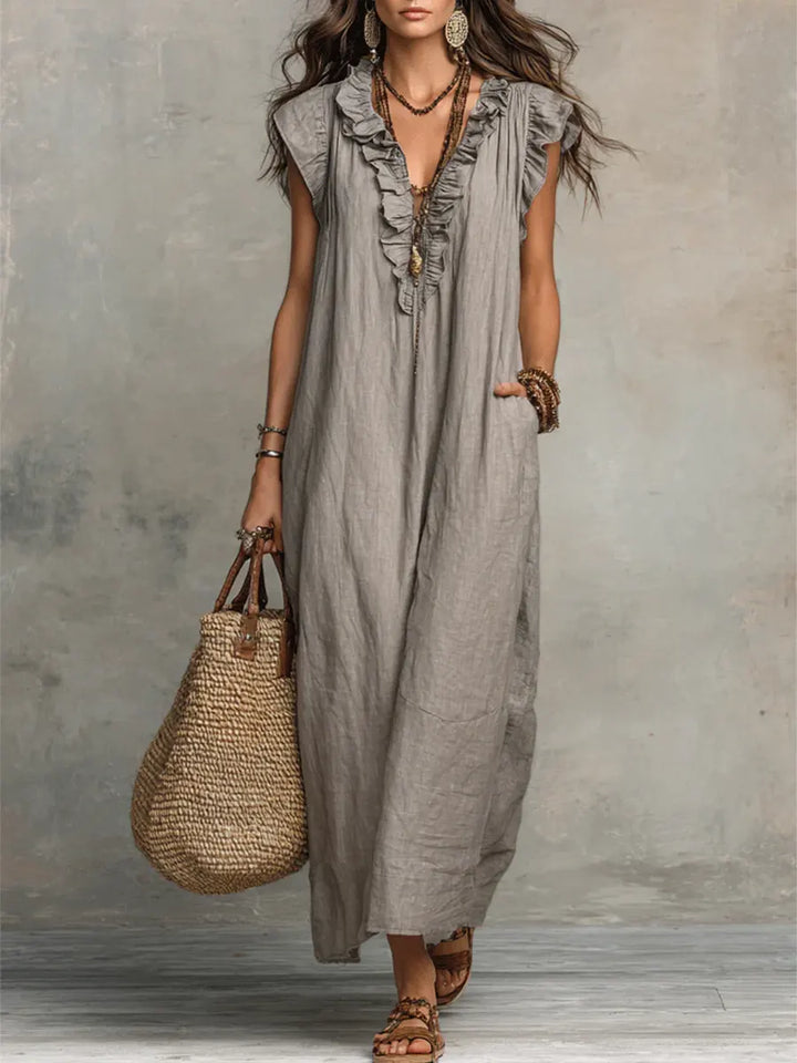 Women's ruffle V-neck maxi dress with flutter sleeves and pockets, ideal for casual summer style.