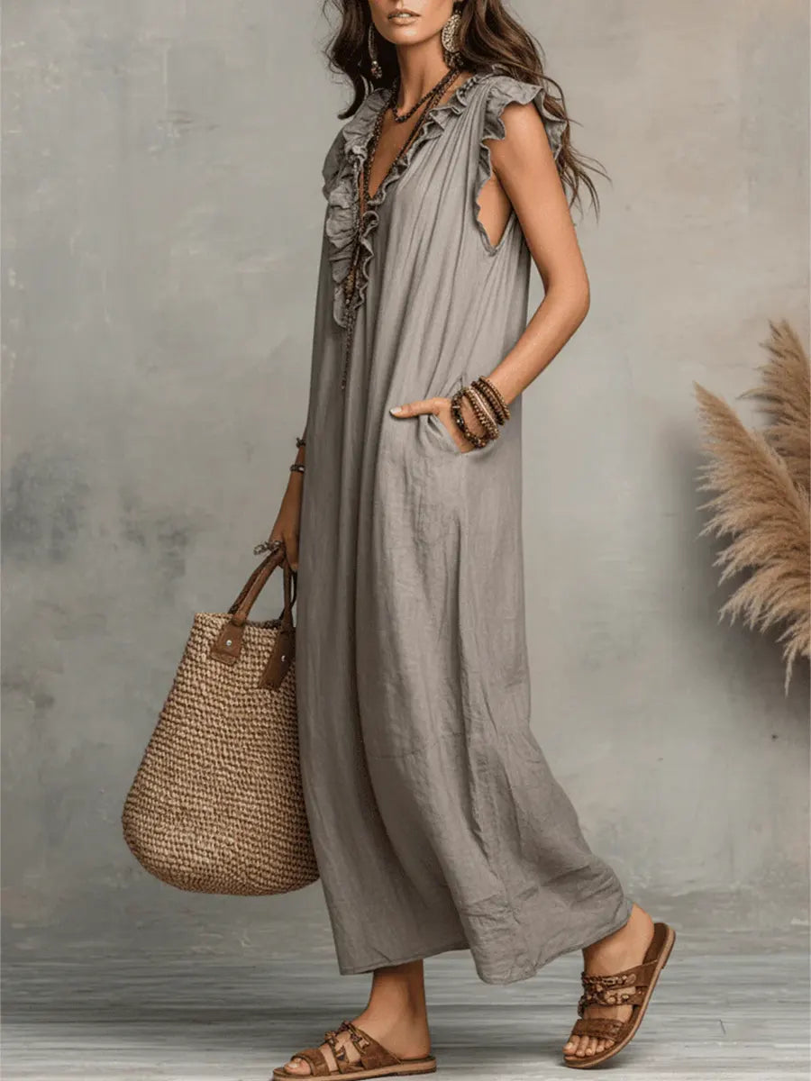 Flowy women's ruffle V-neck maxi dress with flutter sleeves and pockets. Versatile for casual, vacation, or summer wear.